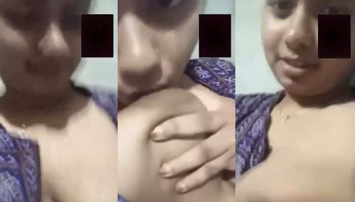 Horny wife sucking own boobs